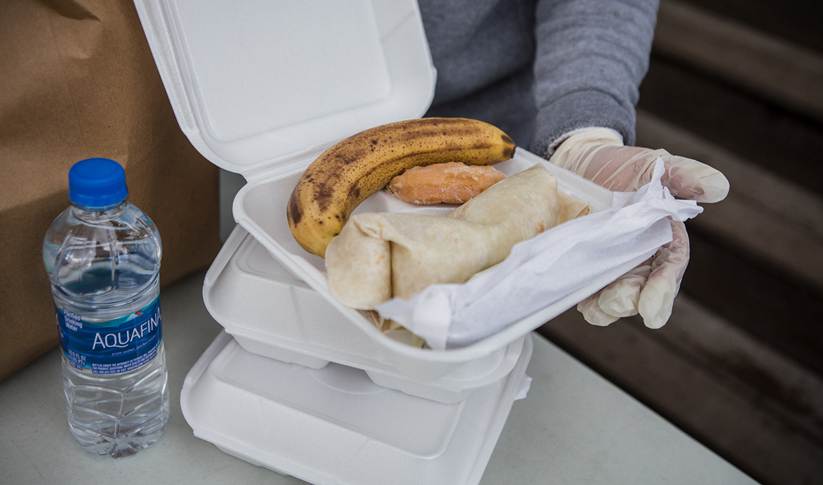 Banana, burrito and other items in a boxed lunch