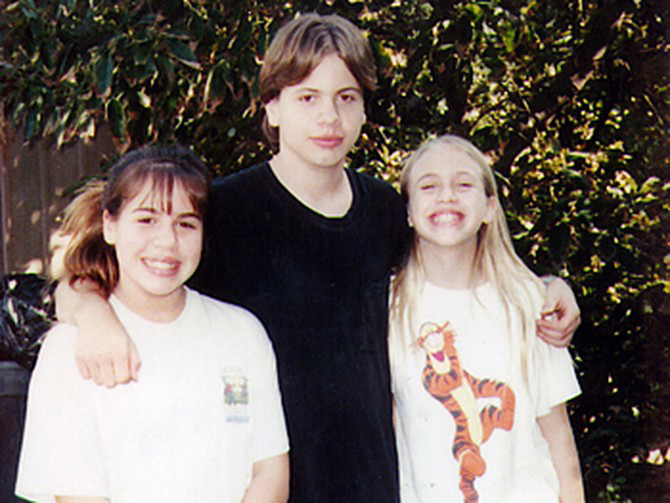 Michael Crowe, as a youth, with his two sisters