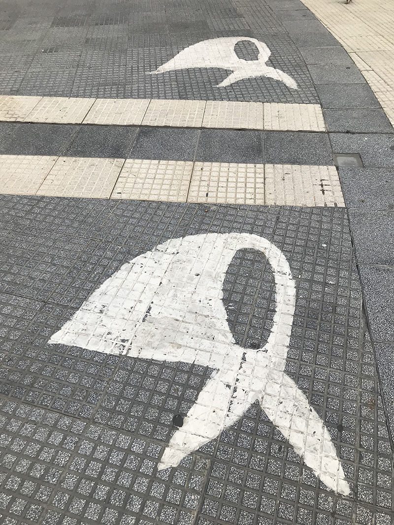 Paintings on the ground of the Plaza de Mayo represent white scarves
