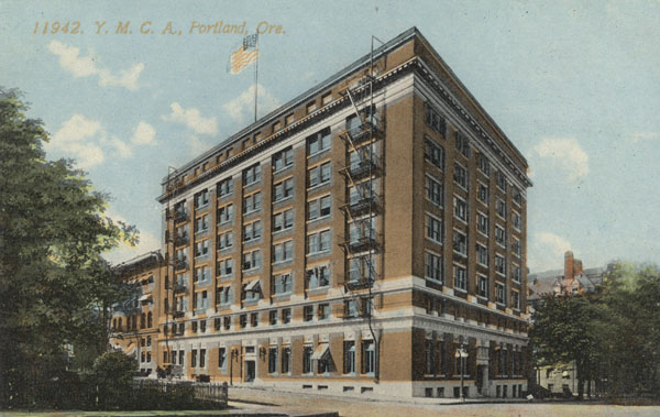 An image of a building on a postcard. The building is large and illustrated.