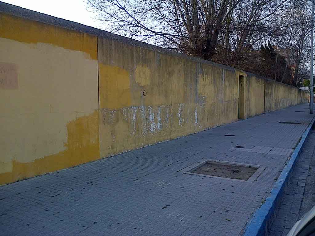 Photo 1 of 2. A drab wall in La Línea, Spain (pictured here), has been transformed into a work of art in collaboration with street artist Victor Ash, pictured in photo 2 of 2.