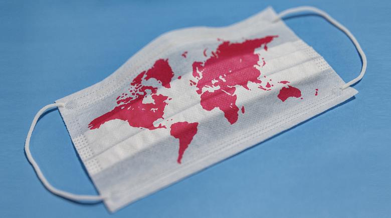 A face mask featuring a map of the world