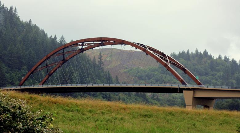 A view of newly renamed Wapato Bridge. The bridge is a tied-arch bridge with steel components.