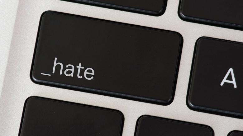 Keyboard with a key that reads: _hate