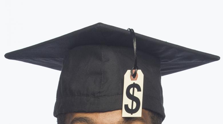 College graduate with dollar sign on cap