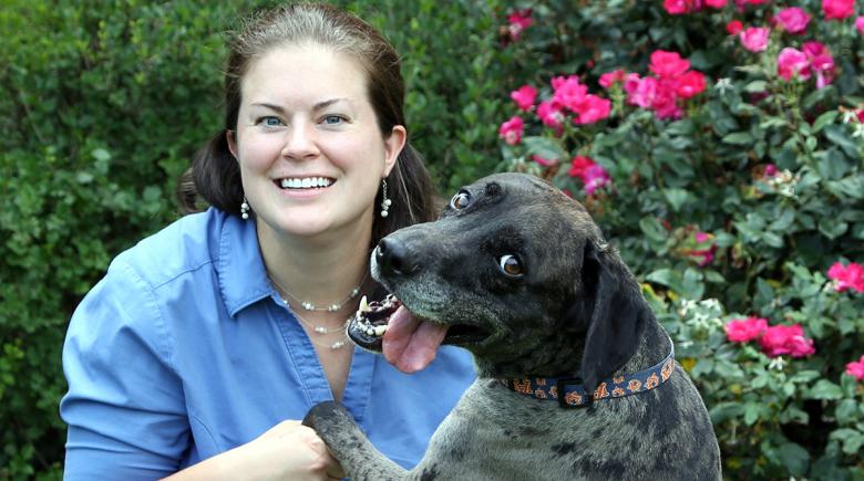 Sarah Crozier embraces a dog