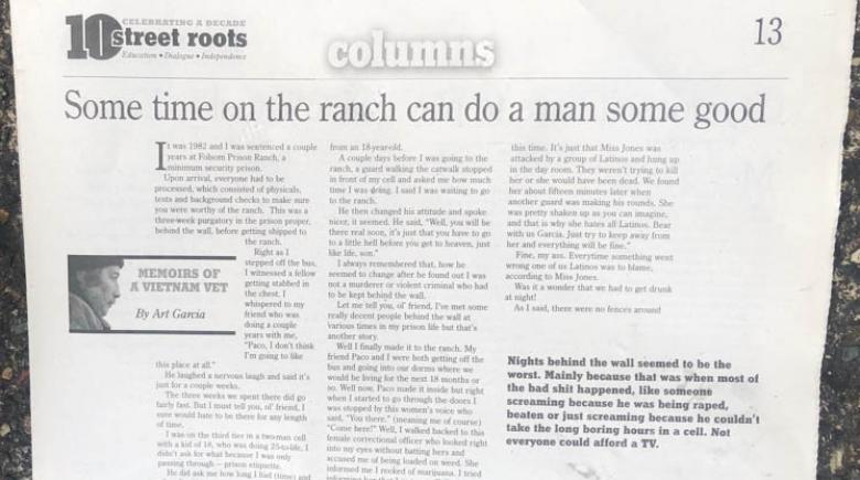 A photo of the print issue of Street Roots from 2009 showing Art's column.