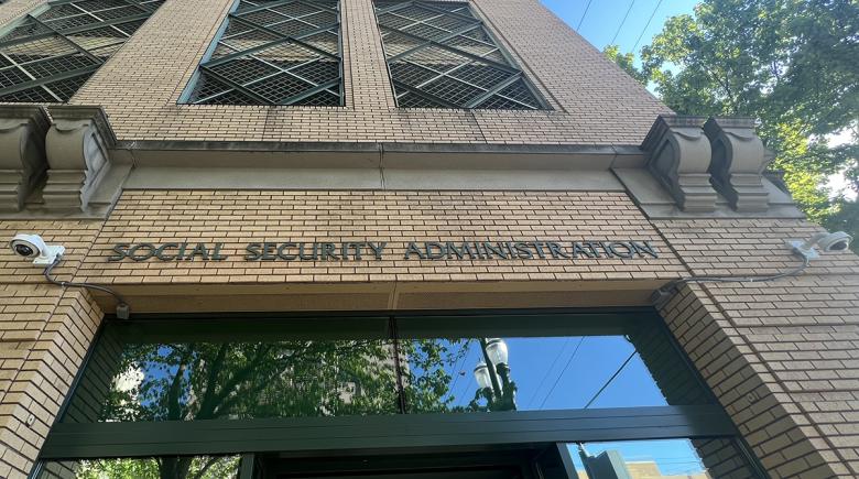 A photo of a brick building that says "Social Security Administration" on the facade.