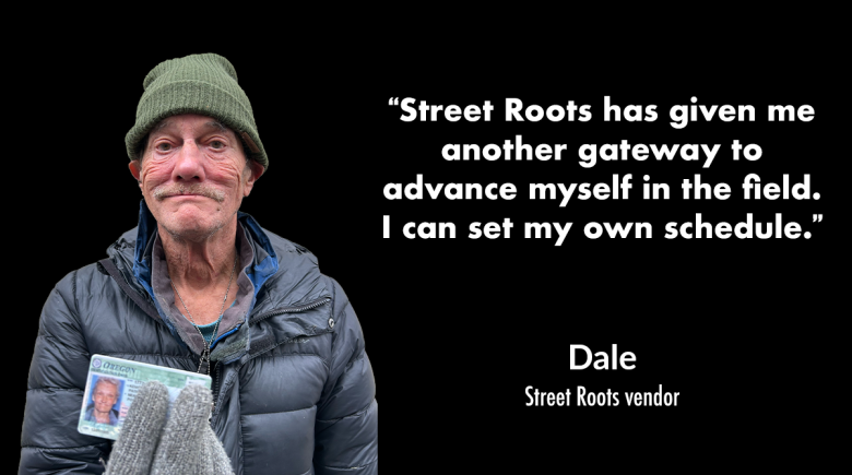 Street Roots vendor Dale wears a beanie and gloves and smiles for a photo. He is holding up to the camera his late girlfriend Patricia's ID photo.