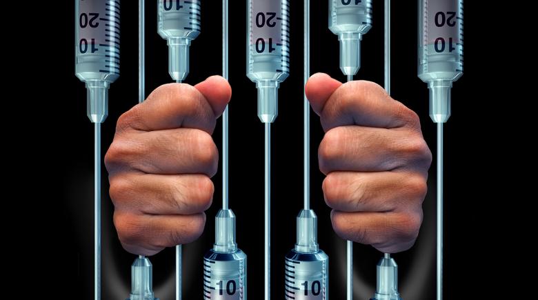 Photo illustration of jail cell with bars made of syringes