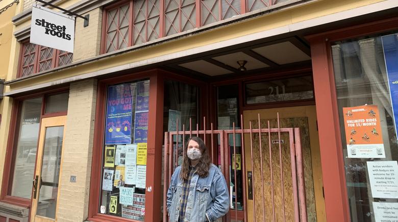 Photo of Street Roots new editor in chief, K. Rambo in front of the Street Roots office.