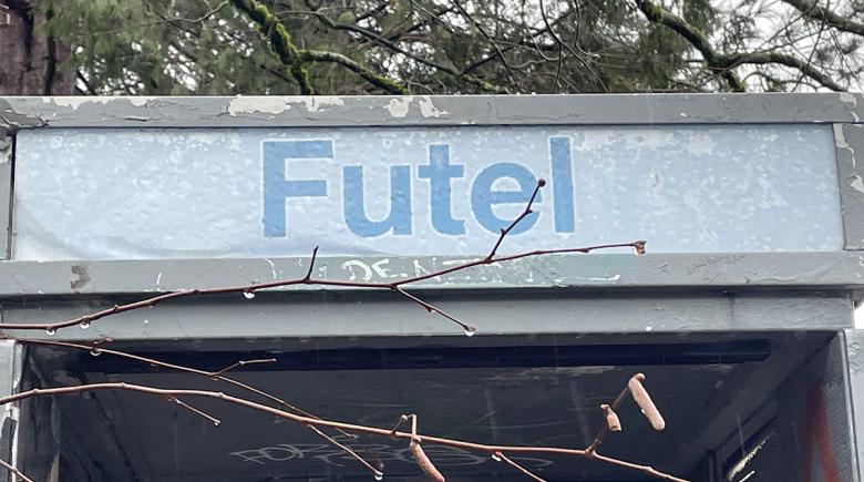 A sign on a public telephone says "Futel"