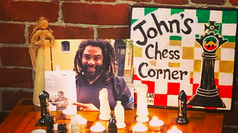 A chess board is set up to honor John Davis