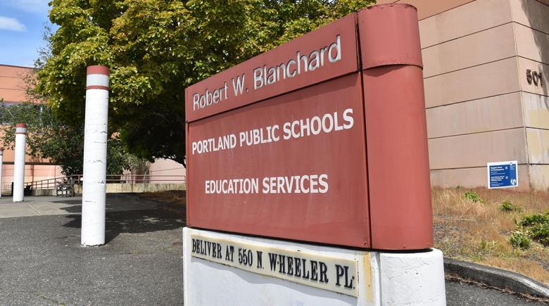 A sign says, "Robert W. Blanchard. Portland Public Schools Education Services."