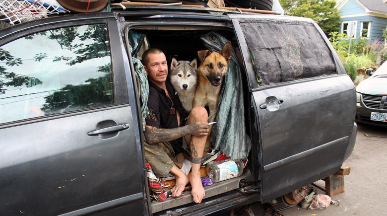 Joshua Peters in his van with his dogs