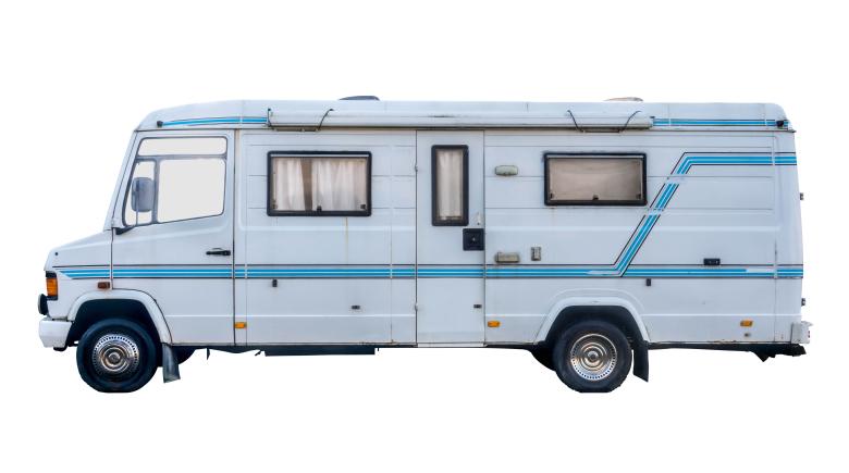 A blue and white RV on a white bacground.