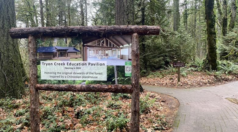 A sign says, "Tryon Creek education pavilion. Opening in 2024. Honoring the original stewards of the forest  