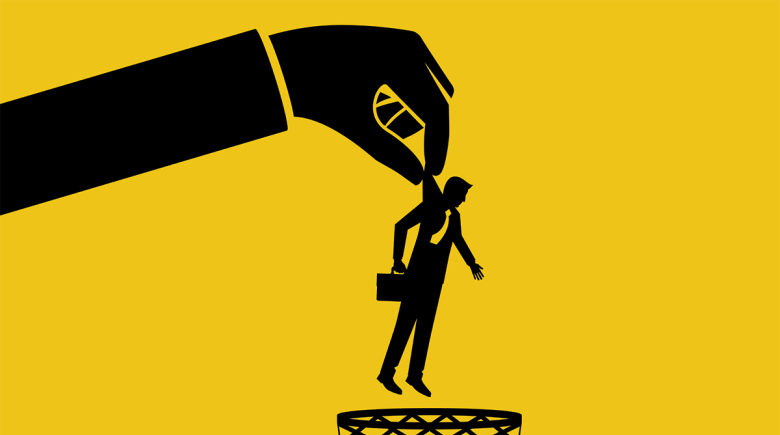 An illustration of a large hand holding a worker in a suit over a trash bin.