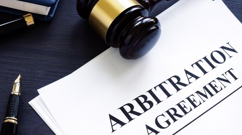Papers labeled "Arbitration Agreement"