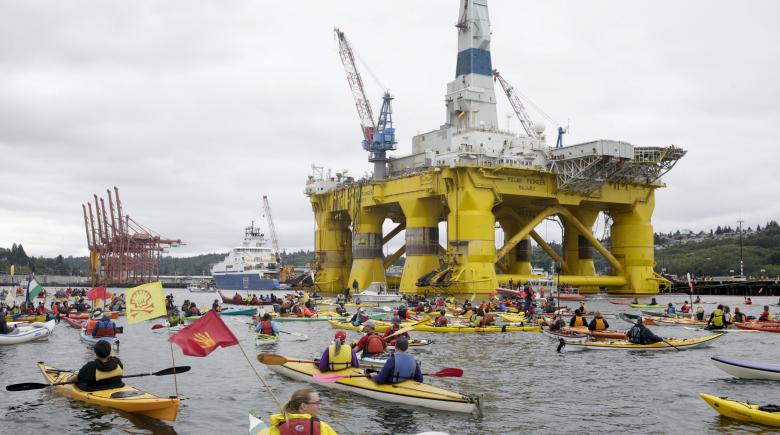 Activists protest the Shell Oil Company’s drilling rig Polar Pioneer which is parked at Terminal 5 at the Port of Seattle, Wash., May 16, 2015.
