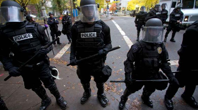Riot police monitor Occupy Portland protesters in Portland on Nov. 13, 2011 REUTERS Steve Dipaola
