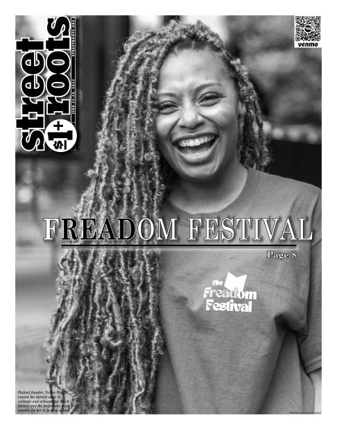 A photo of Street Roots June 22, 2022 cover. Nanea Woods is smiling and posing for the photo and wearing a shirt that says 