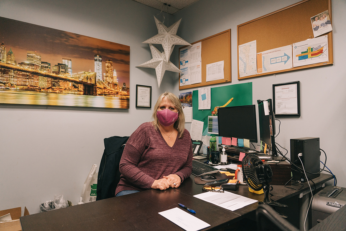 ​Laura Brown wears a mask inside an office